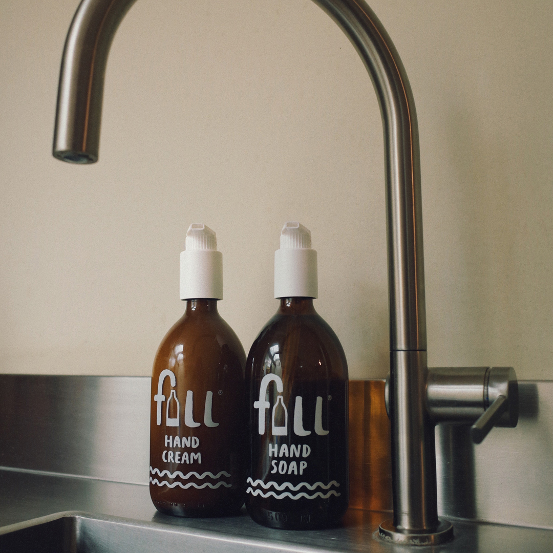 Hand Soap and Hand cream bottles by the sink